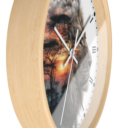 Round wall clock with a light natural wood frame and a split design on the face showing a lion face over an African savanna sunset scene, on a white background.