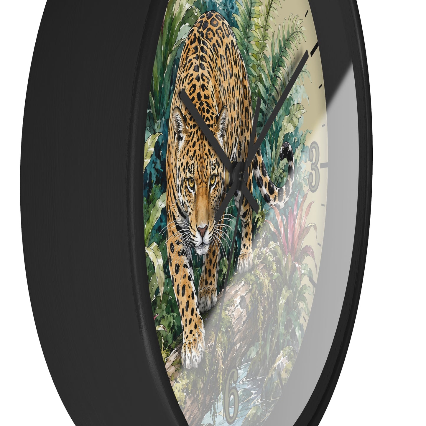 A round wall clock with a black frame and a printed face showing a large spotted big cat walking through dense green foliage. The clock is photographed against a plain white background.