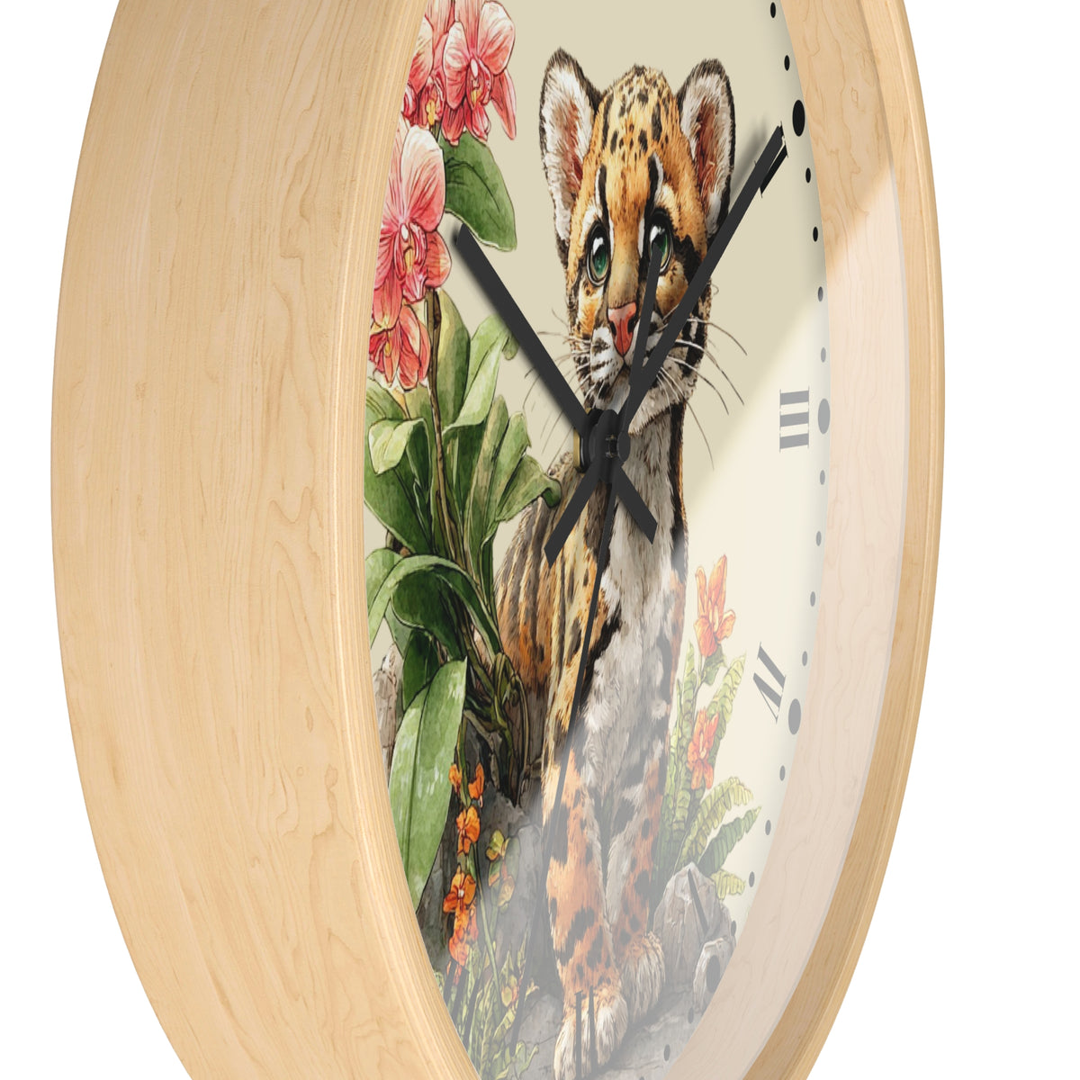 A round wall clock with a light natural wood frame and a printed illustration of a spotted cat among pink flowers and green leaves on the face, shown against a plain white background.