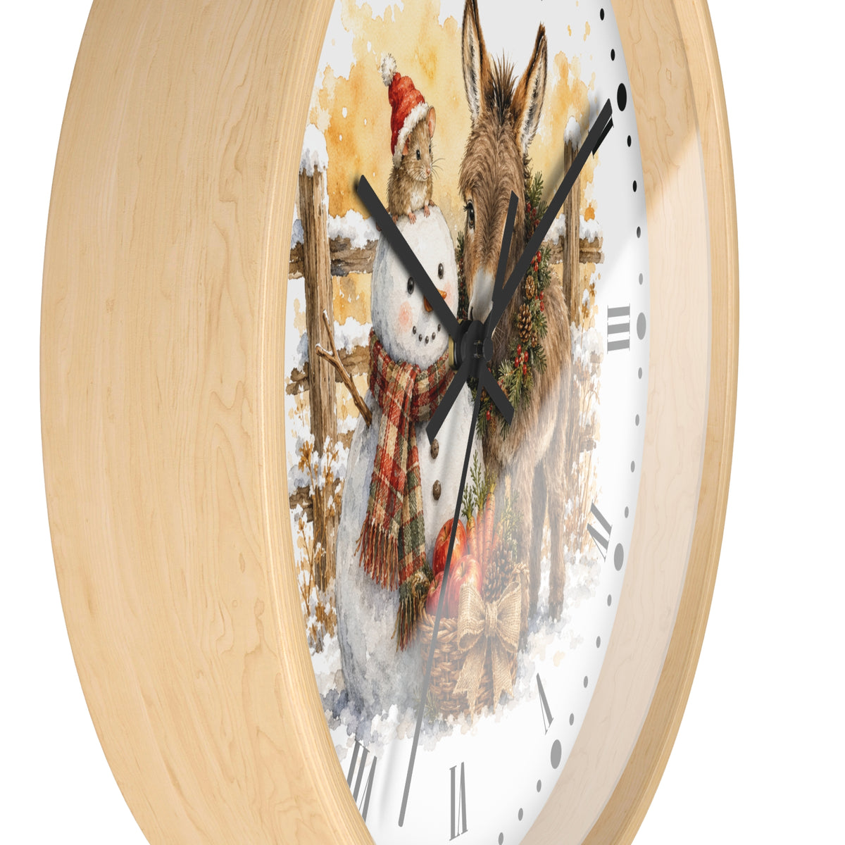 A round wall clock with a light natural wood frame and a white dial featuring a painted winter scene of a rabbit in a Santa hat next to a donkey, with black clock hands and Roman numerals.