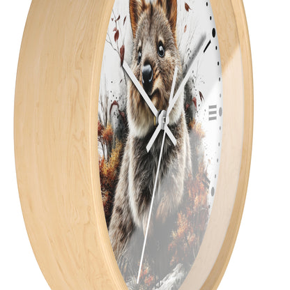 Round wall clock with a light natural wood frame and a printed quokka design on the clock face, shown against a plain white background.