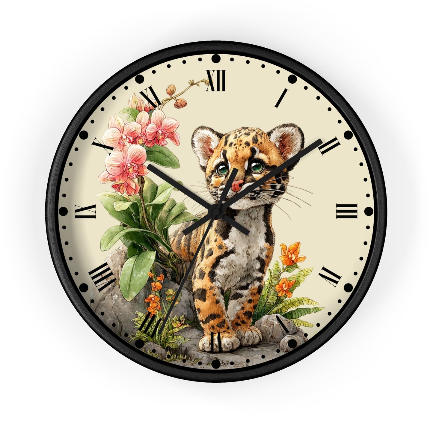 Round wall clock with a black frame and a cream-colored face featuring an illustration of a spotted kitten, pink flowers, green leaves, and small orange blossoms. Roman numerals mark the hours, and the clock hands are black.