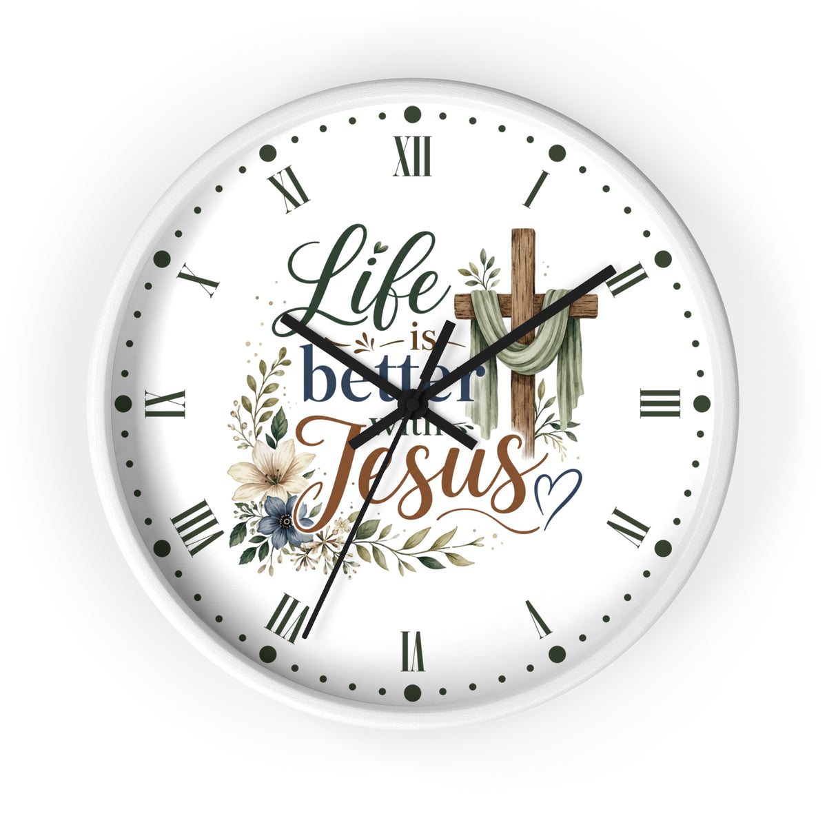 A round white wall clock with a Christian-themed graphic on the face. The design features the text 'Life is better with Jesus' in stylized fonts, a wooden cross draped with green cloth, and delicate floral illustrations.
