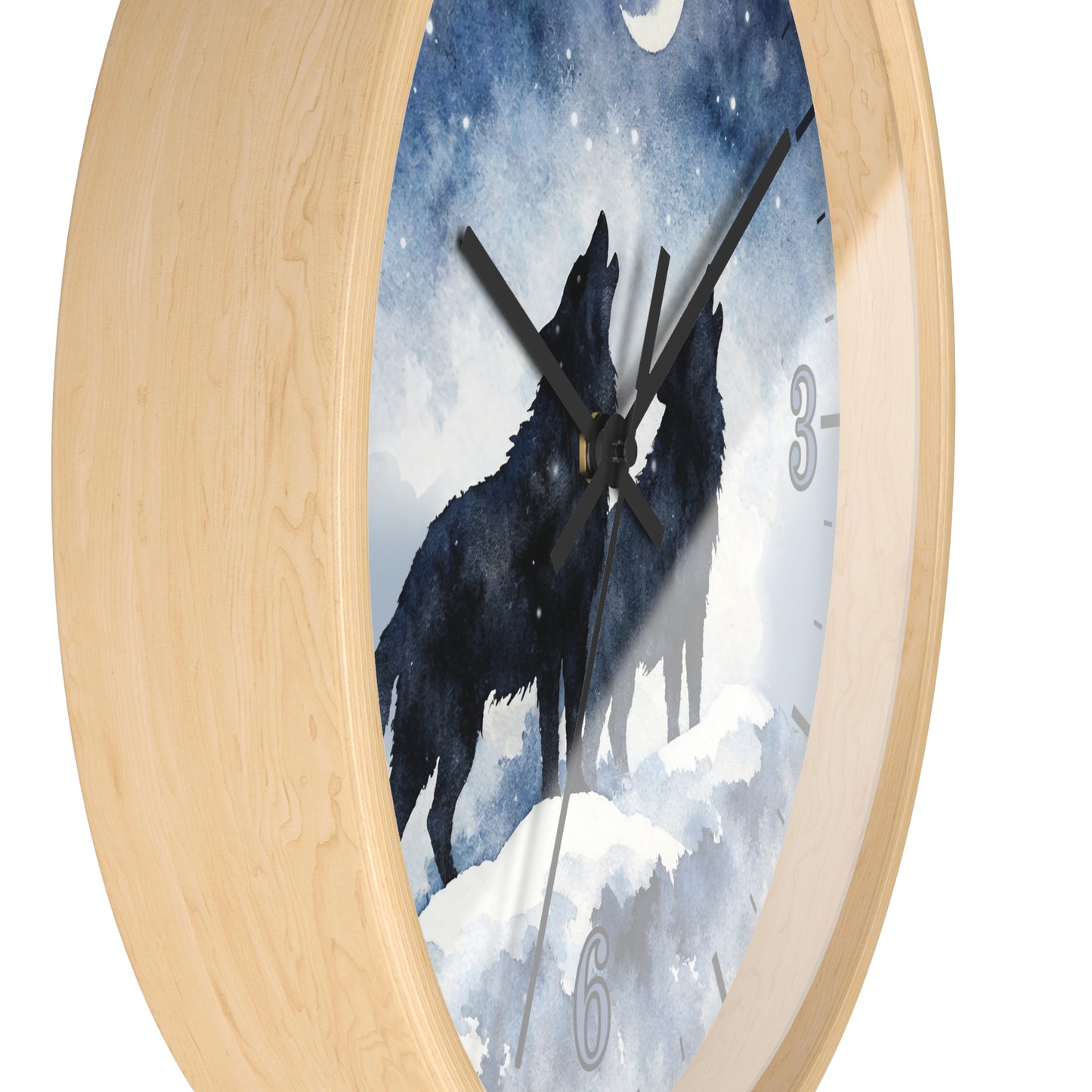 Round wall clock with a light natural wood frame and a printed face showing two black howls in a snowy blue night scene. Partial clock numbers are visible on the right and bottom.