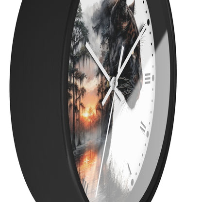 A close-up of a round wall clock with a black frame and a split design: one half shows a white clock face with Roman numerals, and the other half shows a dark panther over a misty swamp at sunset.