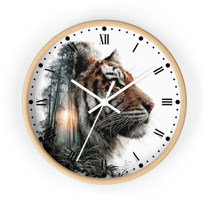 A round wall clock with a light wood frame and a white face featuring a detailed tiger portrait over a misty forest scene. The clock uses black Roman numerals and hour markers with white and black hands, shown against a plain white background.