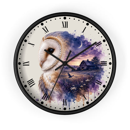 A round wall clock with a black frame and a printed design featuring a large owl on the left half and a purple-toned countryside scene with a barn and moon on the right half. The clock face is off-white with black Roman numerals and black hands.