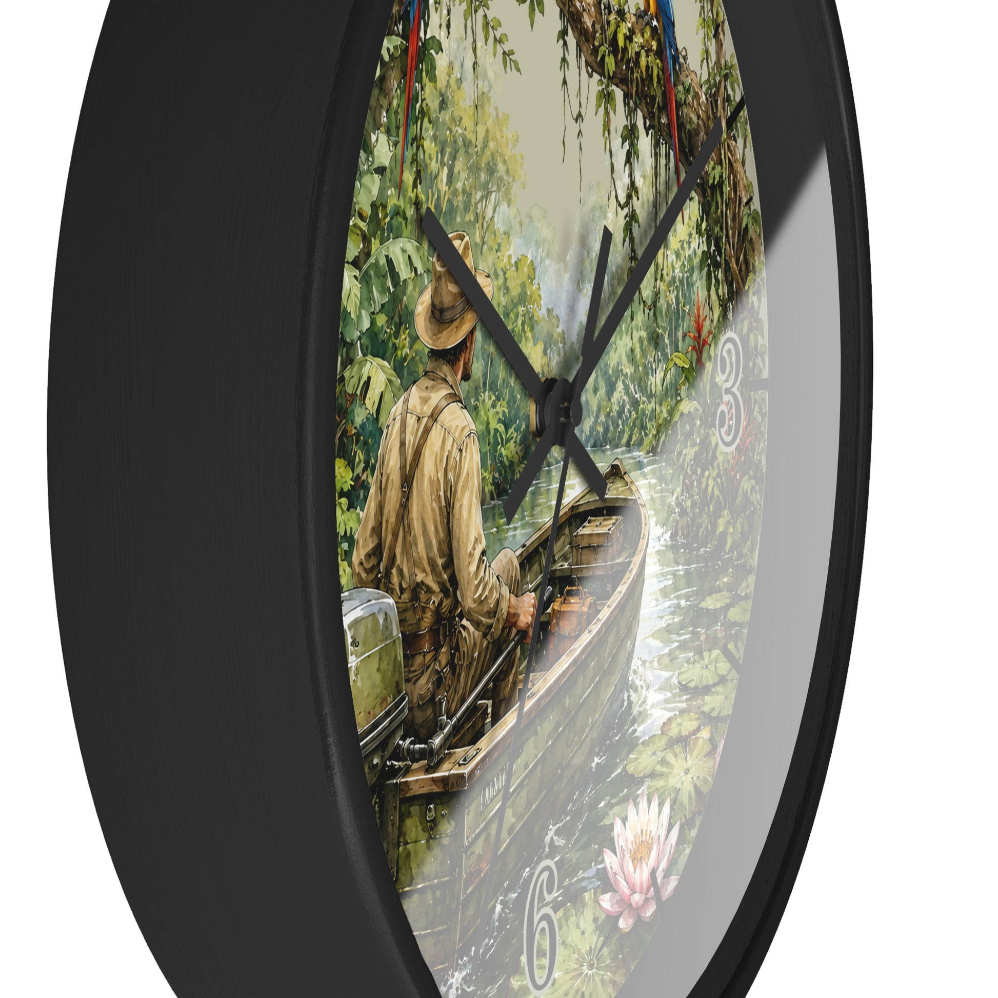 A round wall clock with a black frame and black hands, featuring a scenic illustration of a man in a boat on a river surrounded by lush green trees. The numbers on the clock are stylized as water lilies.