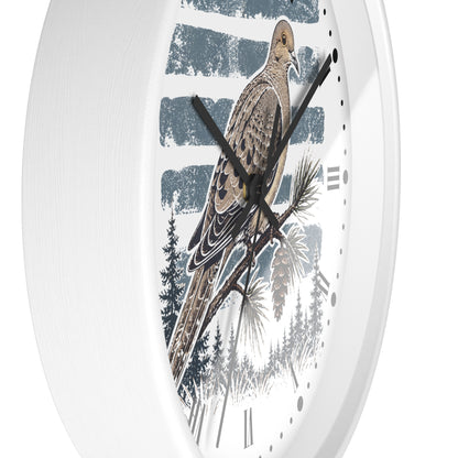 White round wall clock with a printed nature design featuring a brown dove bird perched on a pine branch against a blue and white striped background, with black hands and black Roman numerals.