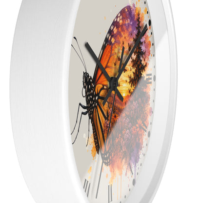 A white round wall clock with a printed butterfly and floral artwork on the face, shown against a plain white background.