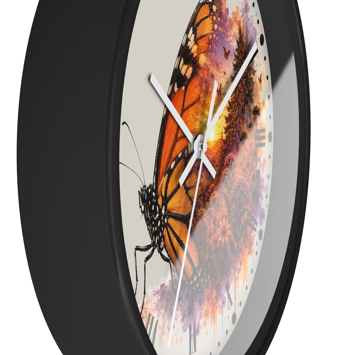 A close-up of a round wall clock with a black frame and a printed butterfly artwork on the face. The design shows a large orange-and-black butterfly over a multicolored watercolor background with white clock hands.
