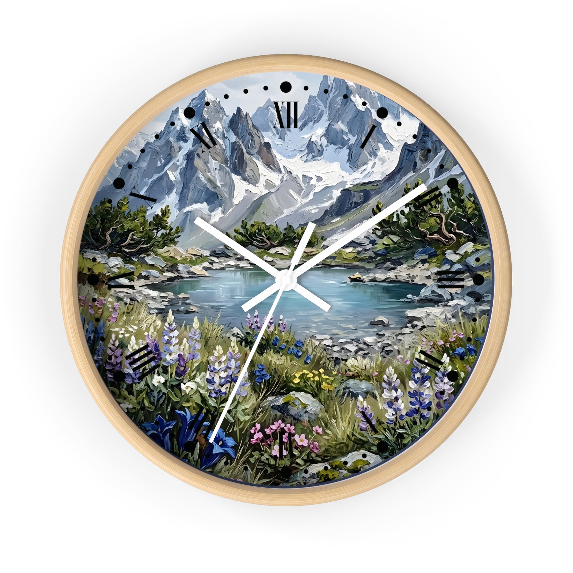 A round wall clock with a light natural wood frame, featuring a scenic landscape print of a mountain lake surrounded by wildflowers, set against a plain white background.