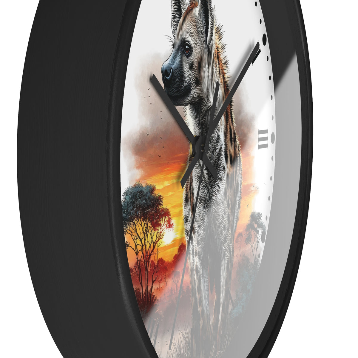A round wall clock with a black frame and a printed design of a hyena standing in front of a warm sunset sky with trees. The clock is shown at an angle against a plain white background.