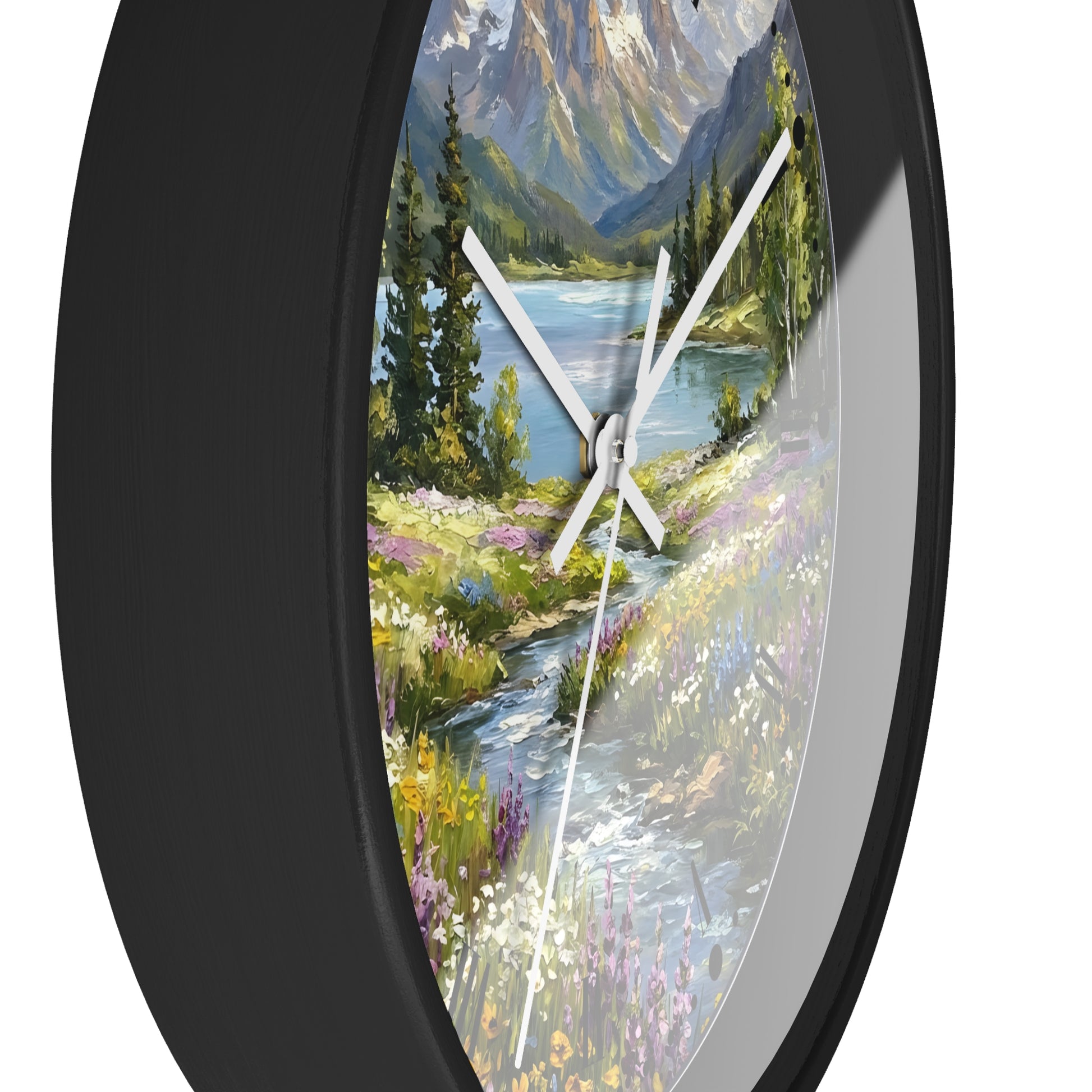 Round wall clock with a black frame and a scenic landscape print featuring a mountain lake, trees, and a stream, shown against a white background.