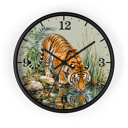 A round wall clock with a black frame and a printed illustration of a tiger drinking water from a stream, with black Arabic numerals on a light background.