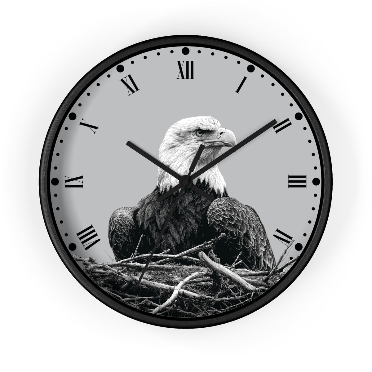Round wall clock with a black frame and a grayscale bald eagle perched in a nest on the clock face, with Roman numerals and black hands on a light gray background.