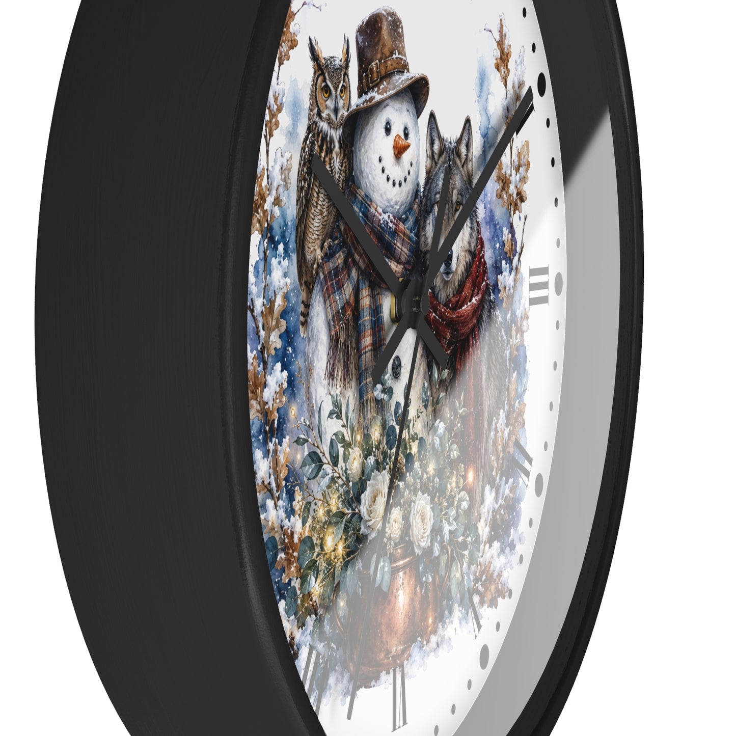 A close-up of a round wall clock with a black frame and a white face featuring a winter illustration of a snowman and two cats wearing scarves and hats.