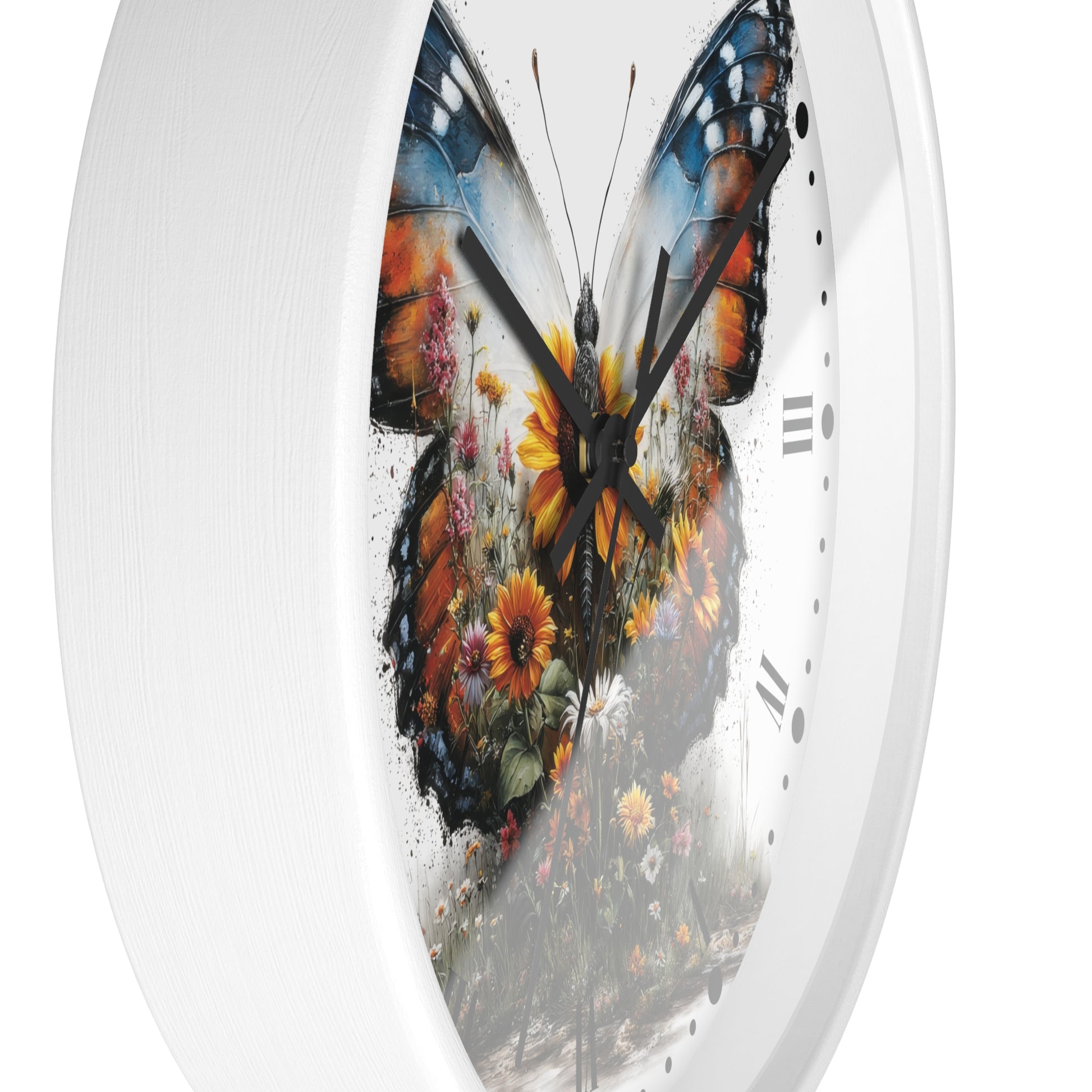 A white round wall clock with a large butterfly design printed on the face. The butterfly artwork features orange, blue, black, yellow, and brown tones with floral details, and the clock has black hands and simple black hour markers.