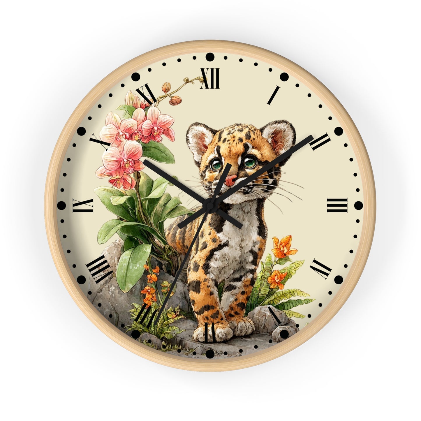 Round wall clock with a light wood frame and a cream-colored face, featuring a detailed illustration of a spotted kitten sitting among pink flowers and green leaves. The clock has black Roman numerals, black hands, and black minute markers.