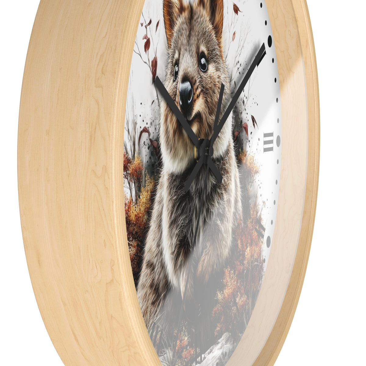 Round wall clock with a light natural wood frame and a printed quokka in autumn design on the clock face, shown against a plain white background.