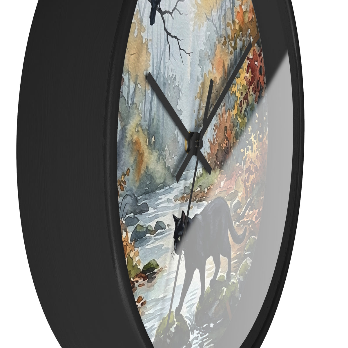 Round wall clock with a black frame and a printed autumn forest face featuring a black cat silhouette, water stream, and colorful foliage.