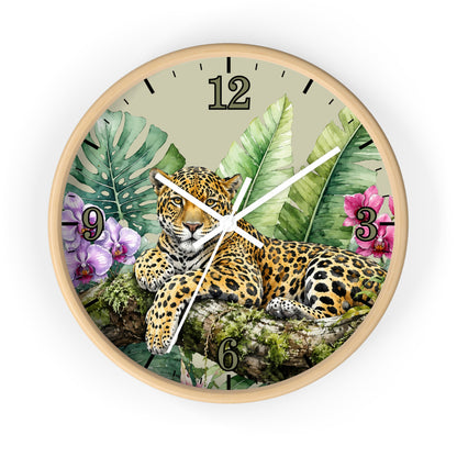 Round wall clock with a light wood frame and a tropical jungle design featuring a leopard, palm leaves, flowers, and black Arabic numerals on a light beige background.