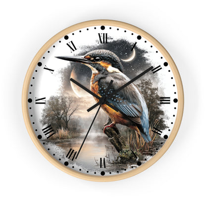 A round wall clock with a light wood frame and a printed nature scene on the dial, featuring a kingfisher perched over water at dusk with Roman numerals and black hands.
