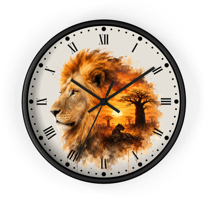 A round wall clock with a black frame and Roman numerals, featuring a watercolor-style design of a lion profile merging into an African savanna sunset scene with a seated lion cub and acacia trees on a white background.