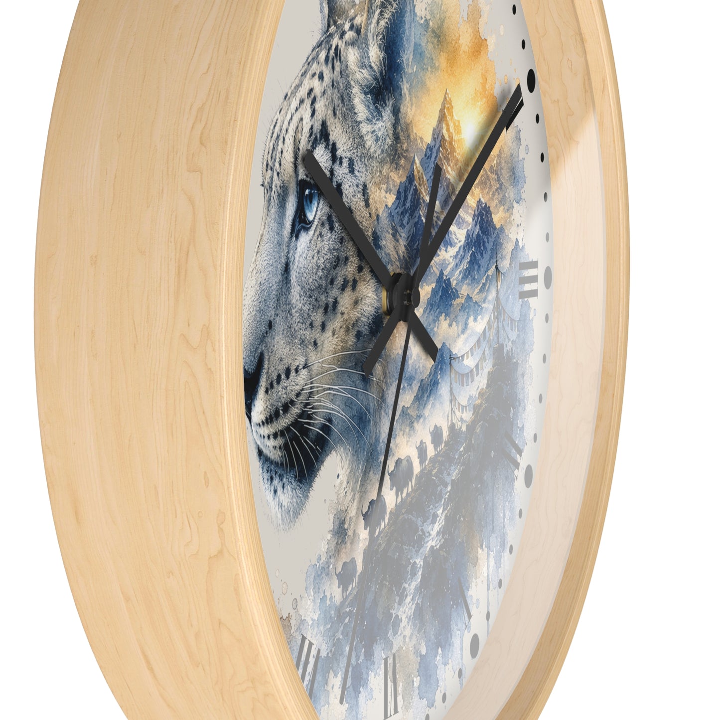 Round wall clock with a light natural wood frame and a printed face featuring a leopard face blended with blue-gray mountains and warm golden sky.
