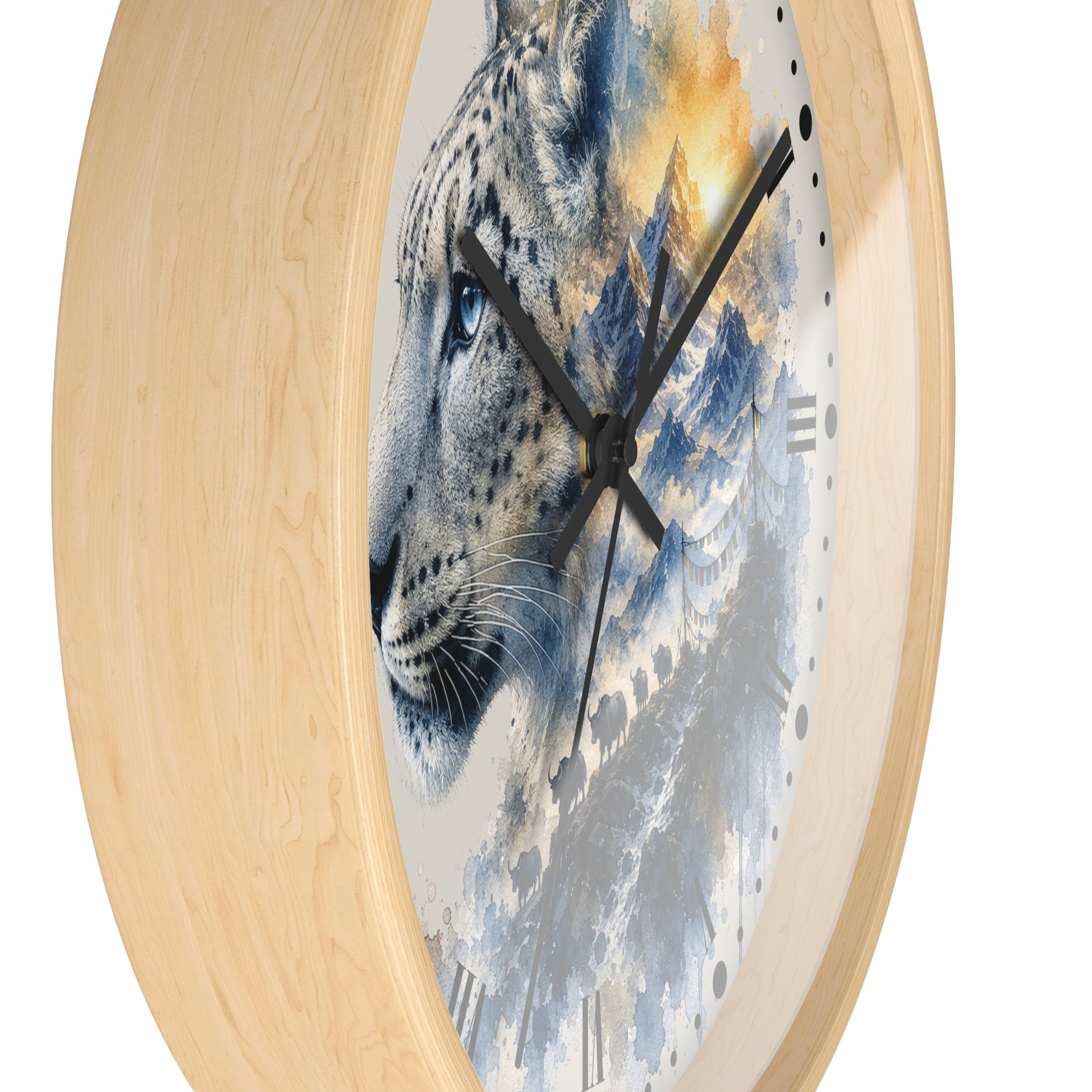 Round wall clock with a light natural wood frame and a printed face featuring a leopard face blended with blue-gray mountains and warm golden sky.