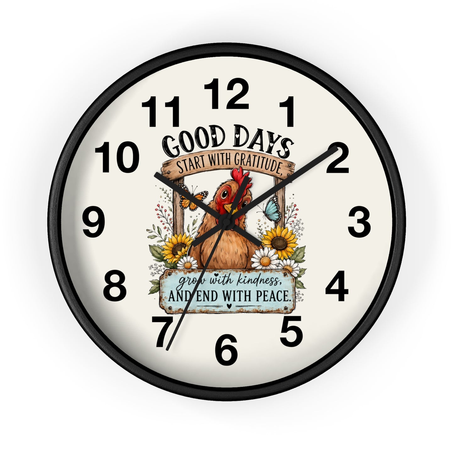 A round wall clock with a black frame and a cream-colored face, featuring a central illustration of a brown chicken surrounded by sunflowers and the text 'GOOD DAYS START WITH GRATITUDE' and 'grow with kindness AND END WITH PEACE'.