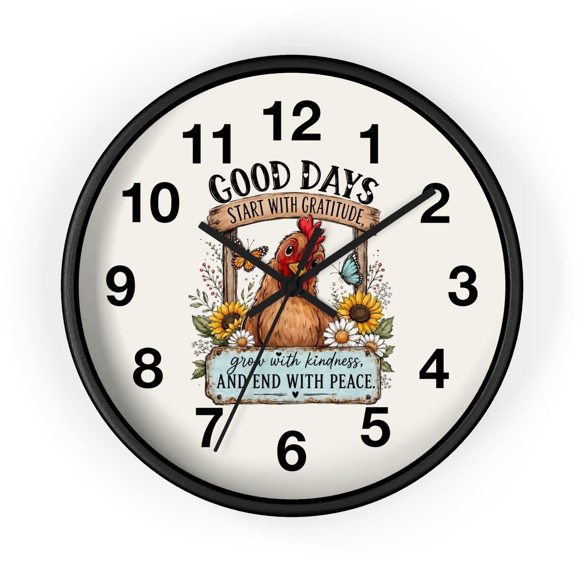 A round wall clock with a black frame and a cream-colored face, featuring a central illustration of a brown chicken surrounded by sunflowers and the text 'GOOD DAYS START WITH GRATITUDE' and 'grow with kindness AND END WITH PEACE'.