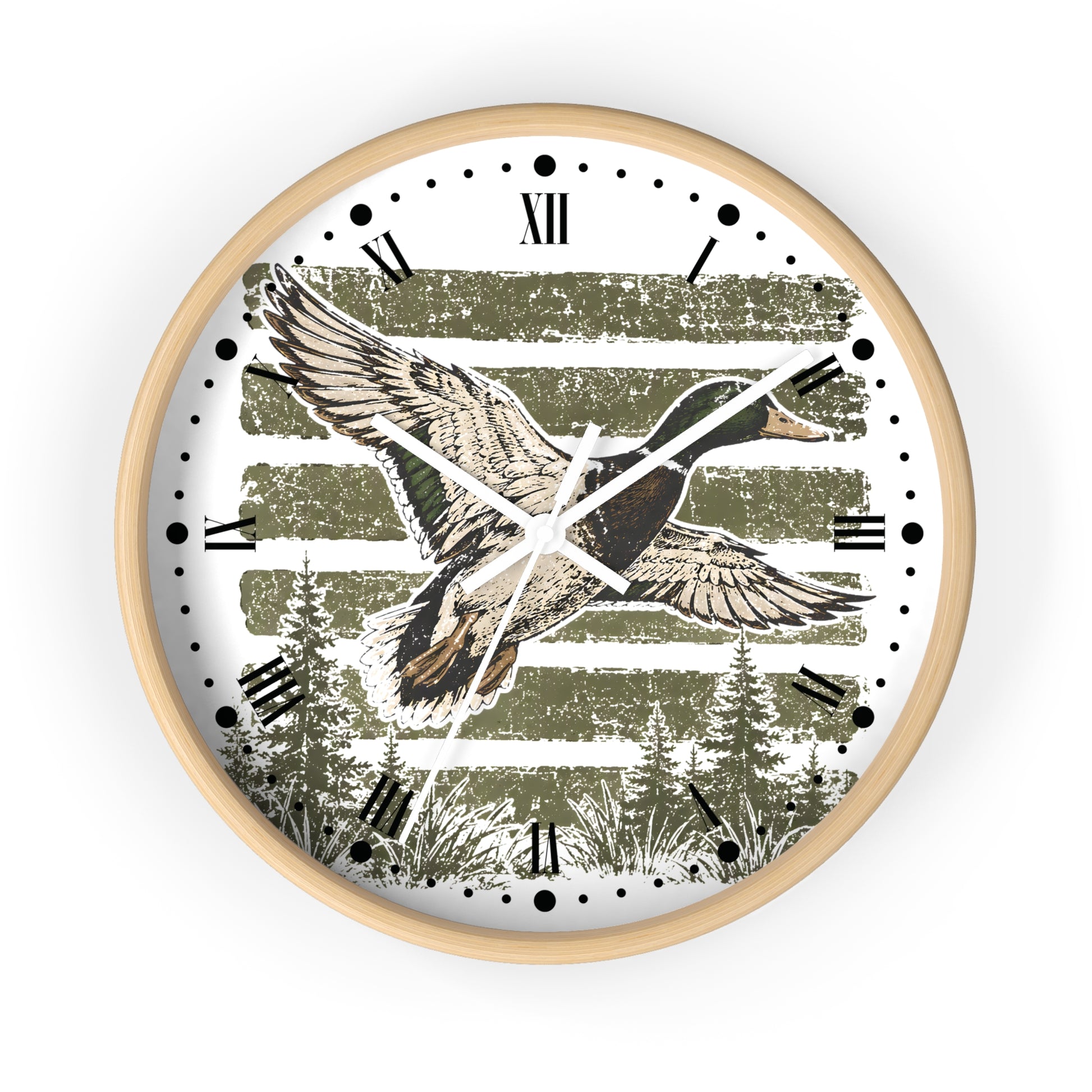 Round wall clock with a light wood frame and a white face featuring a flying duck over distressed olive-green horizontal stripes and pine trees, with black Roman numerals and markers.