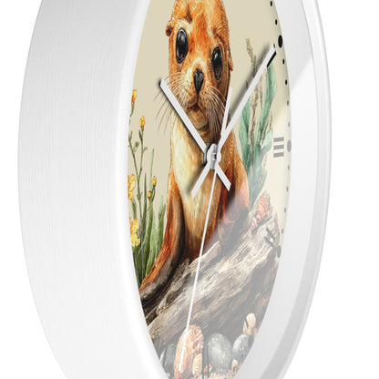 A round wall clock with a white frame and a printed face featuring a seal pup sitting on a log with flowers and shells, shown against a plain white background.