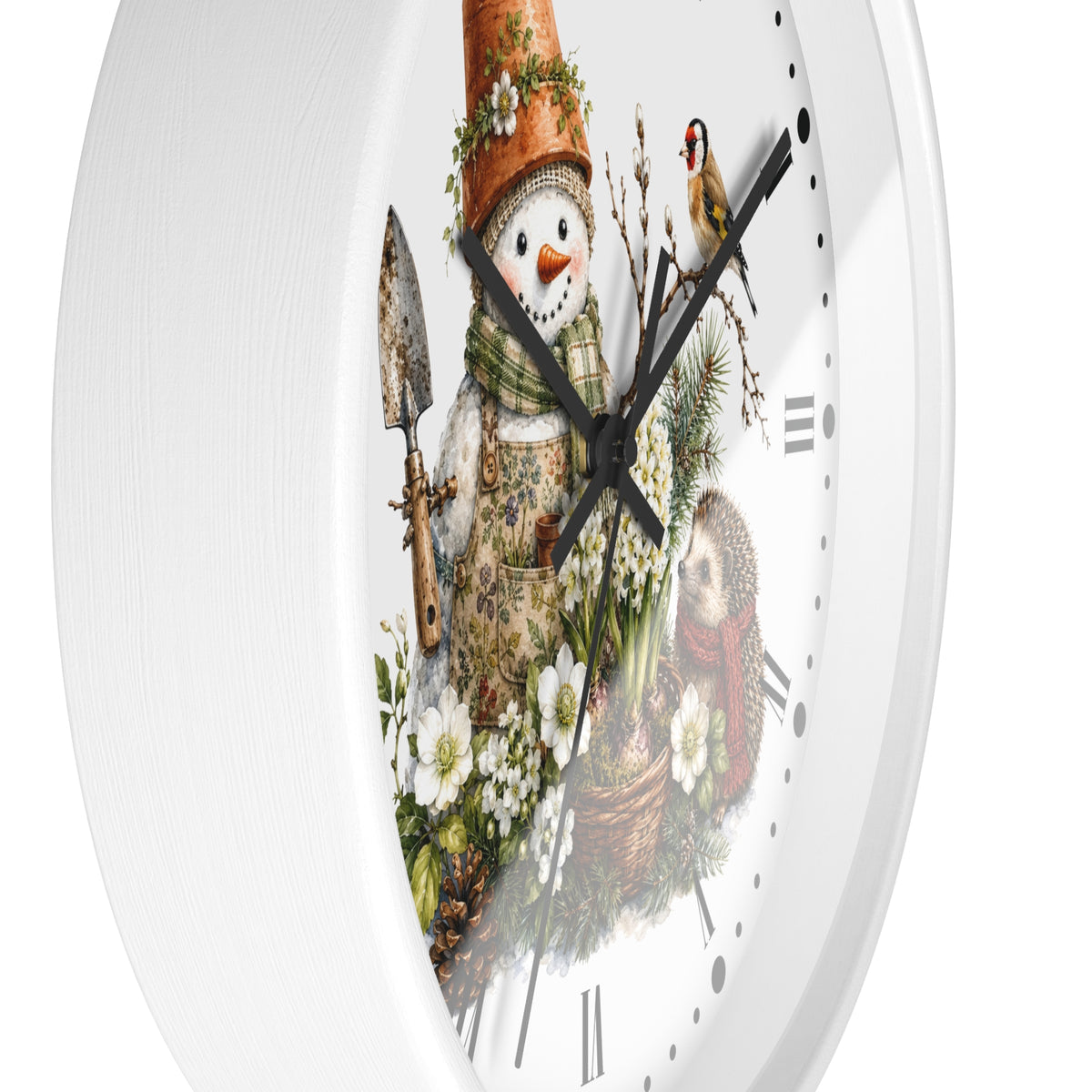 A white round wall clock with a whimsical winter garden illustration on the face, featuring a snowman in a terracotta pot hat, flowers, a bird, and a basket, with black Roman numeral hour markers and black hands.