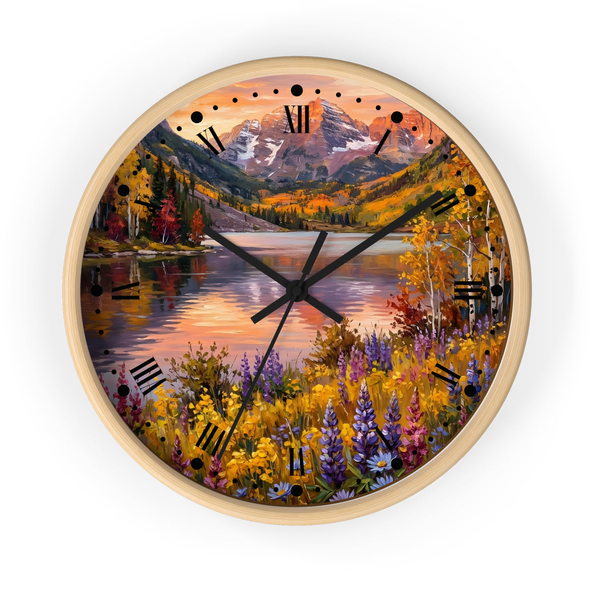 A round wall clock with a light wood frame and a scenic autumn landscape printed on the face, featuring mountains, a lake, colorful trees, and wildflowers. The clock has black Roman numerals and black hands and is shown against a plain white background.