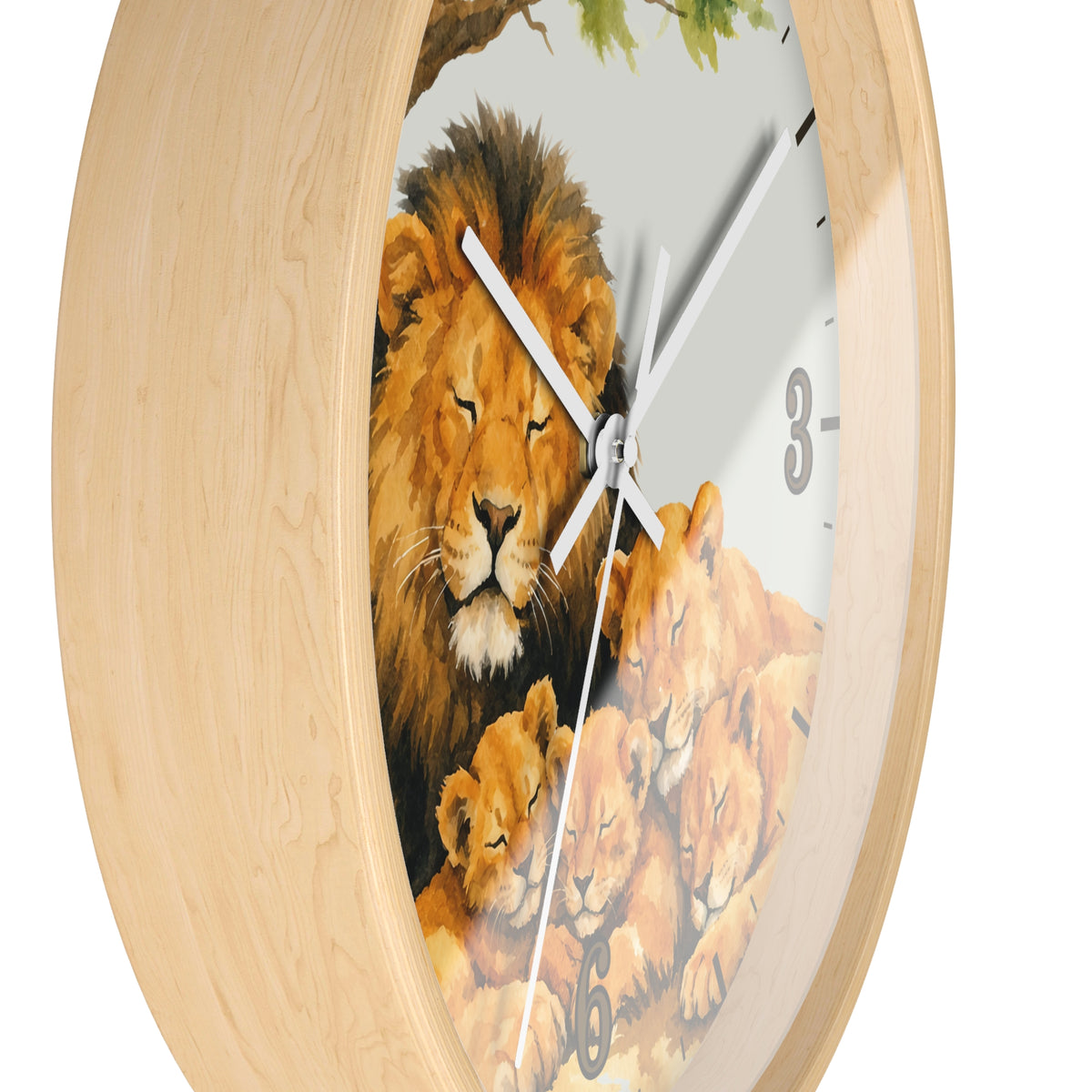 Round wall clock with a light natural wood frame and a printed lion family illustration on the face, including a large adult lion, two cubs, and a tree branch at the top.