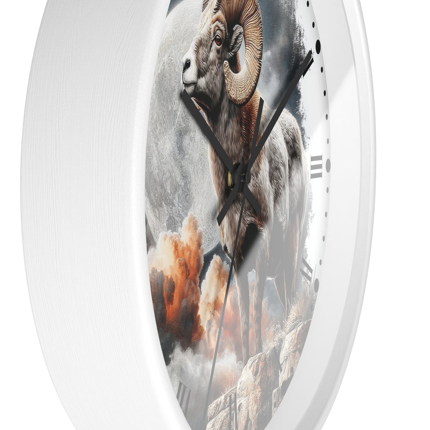 A white round wall clock featuring a detailed graphic print of a bighorn sheep standing on rocky terrain with clouds and a moon in the background.