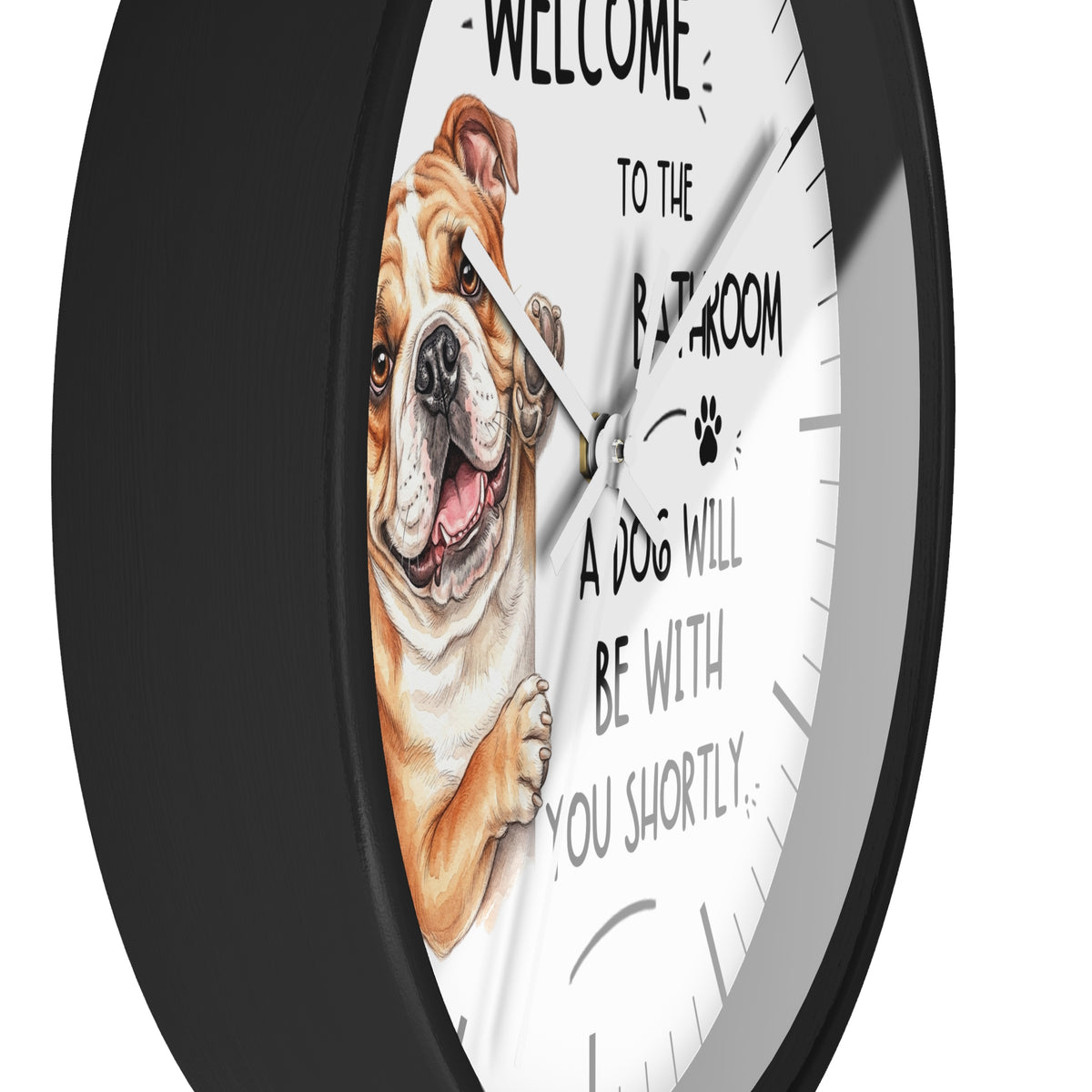 A round wall clock with a black frame and a white face featuring an illustration of a bulldog and the text 'WELCOME TO THE BATHROOM A DOG WILL BE WITH YOU SHORTLY'.