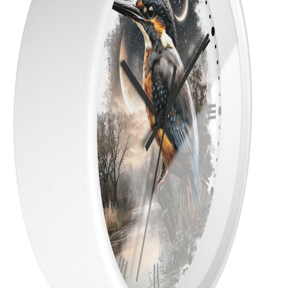 A white oval wall clock featuring a printed fantasy-style illustration of a kingfisher bird over a misty landscape with a full moon and dark sky.