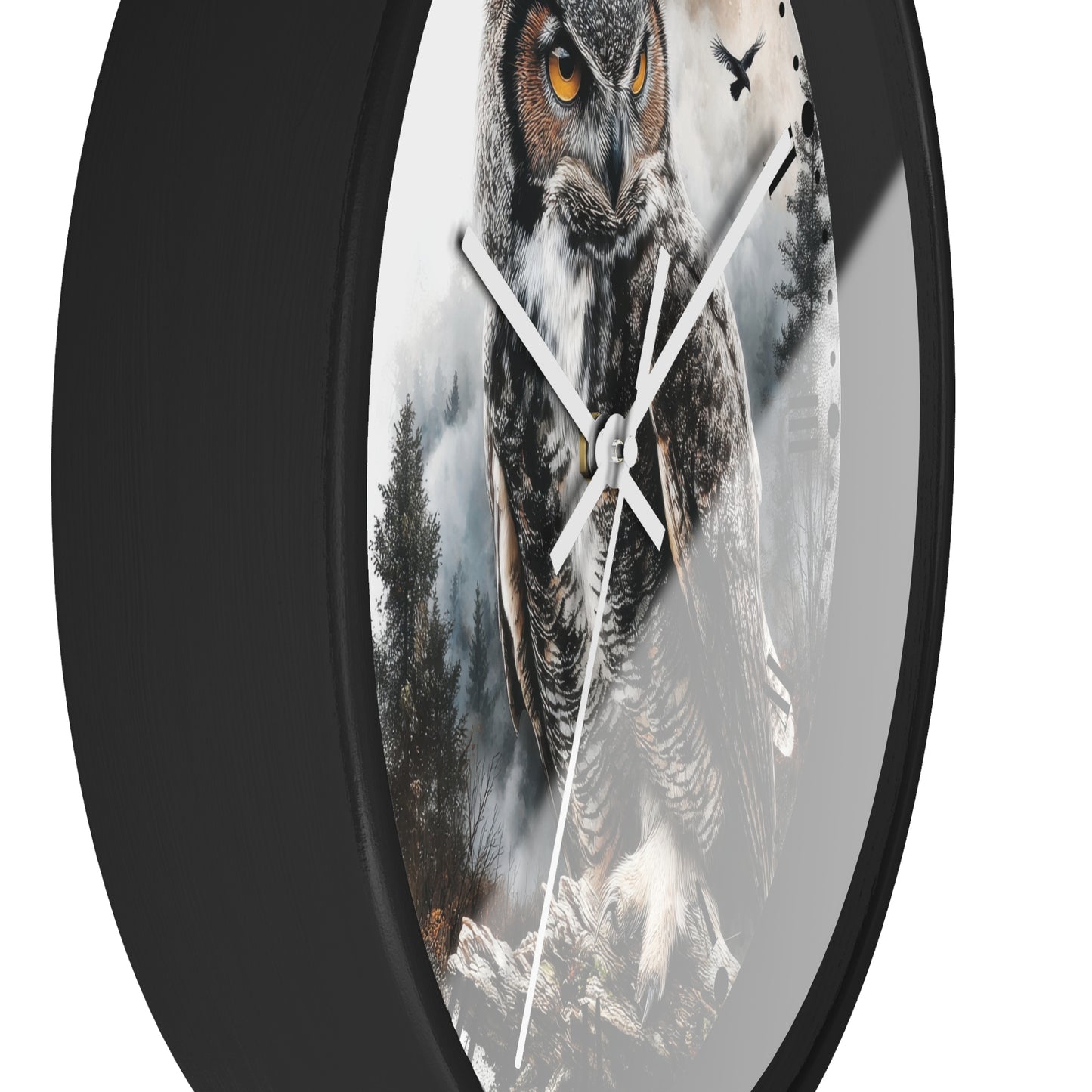Round wall clock with a black frame and a printed design of a large owl in misty forest scenery, shown against a plain white background.