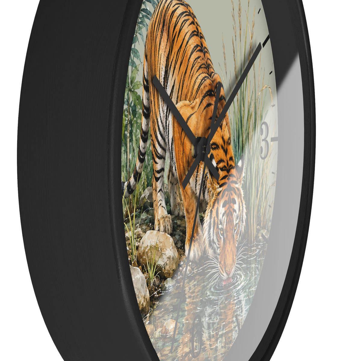 Round wall clock with a black frame and a printed tiger drinking water scene on the face, shown against a plain white background.