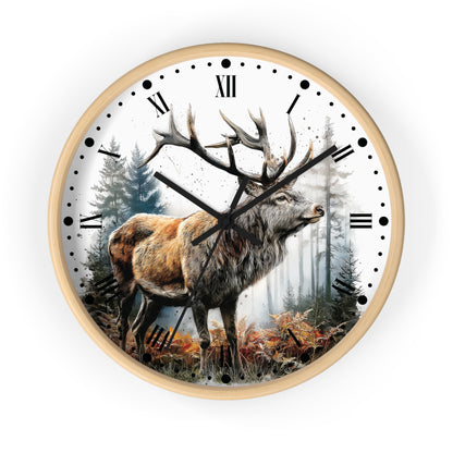 A round wall clock with a light wood frame and a white face featuring a detailed illustration of a stag with large antlers in a misty forest. The clock has black Roman numerals, black hour and minute hands, and black minute markers.