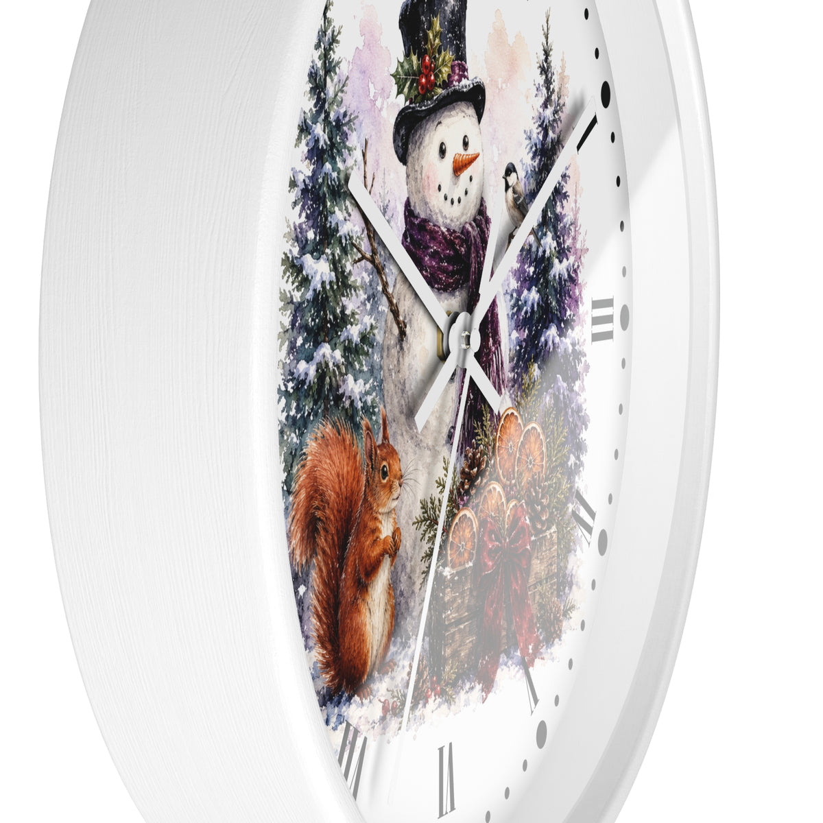 A white round wall clock with a winter woodland illustration on the face, featuring a snowman in a top hat, a squirrel, evergreen trees, and a small bird, with silver hands and black Roman numerals.