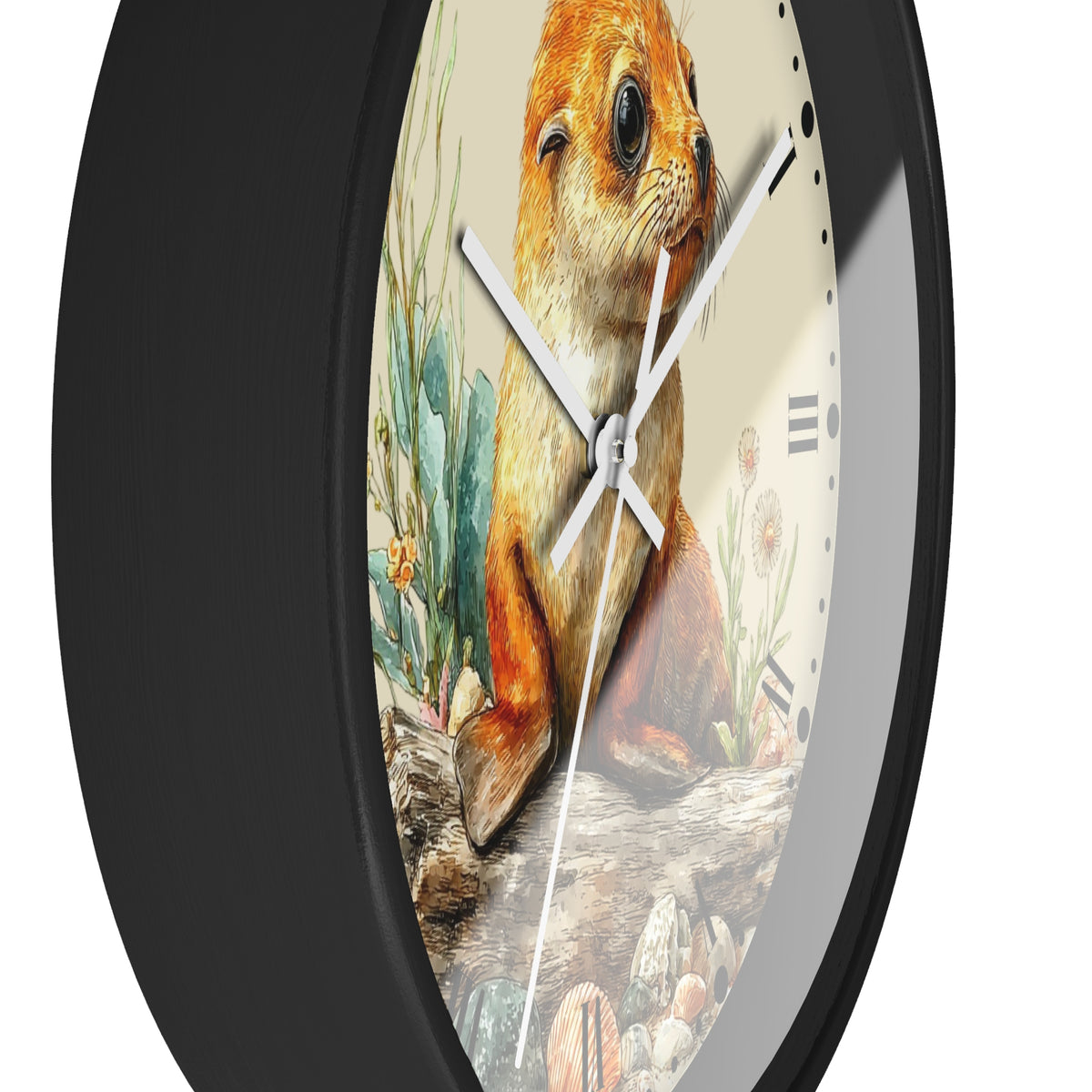 A close-up of a round wall clock with a black frame and a printed face showing a seal illustration with desert plants and rocks. The clock is photographed against a plain white background.
