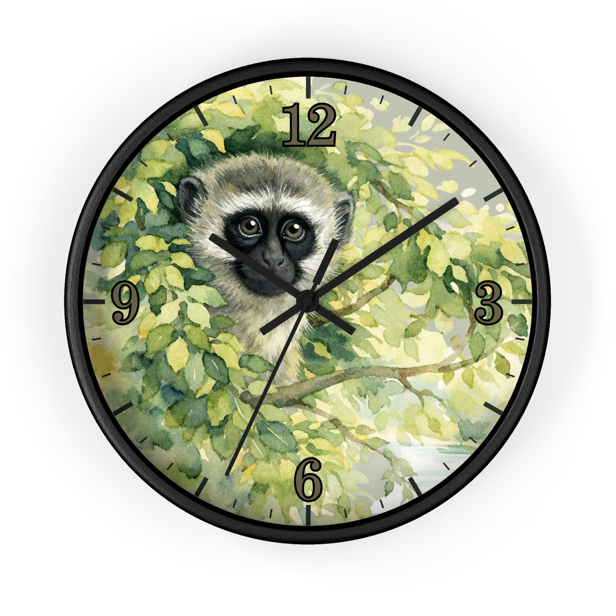 Round wall clock with a black frame and a printed illustration of a vervet monkey among green leaves on the clock face, with black Arabic numerals and black hands.