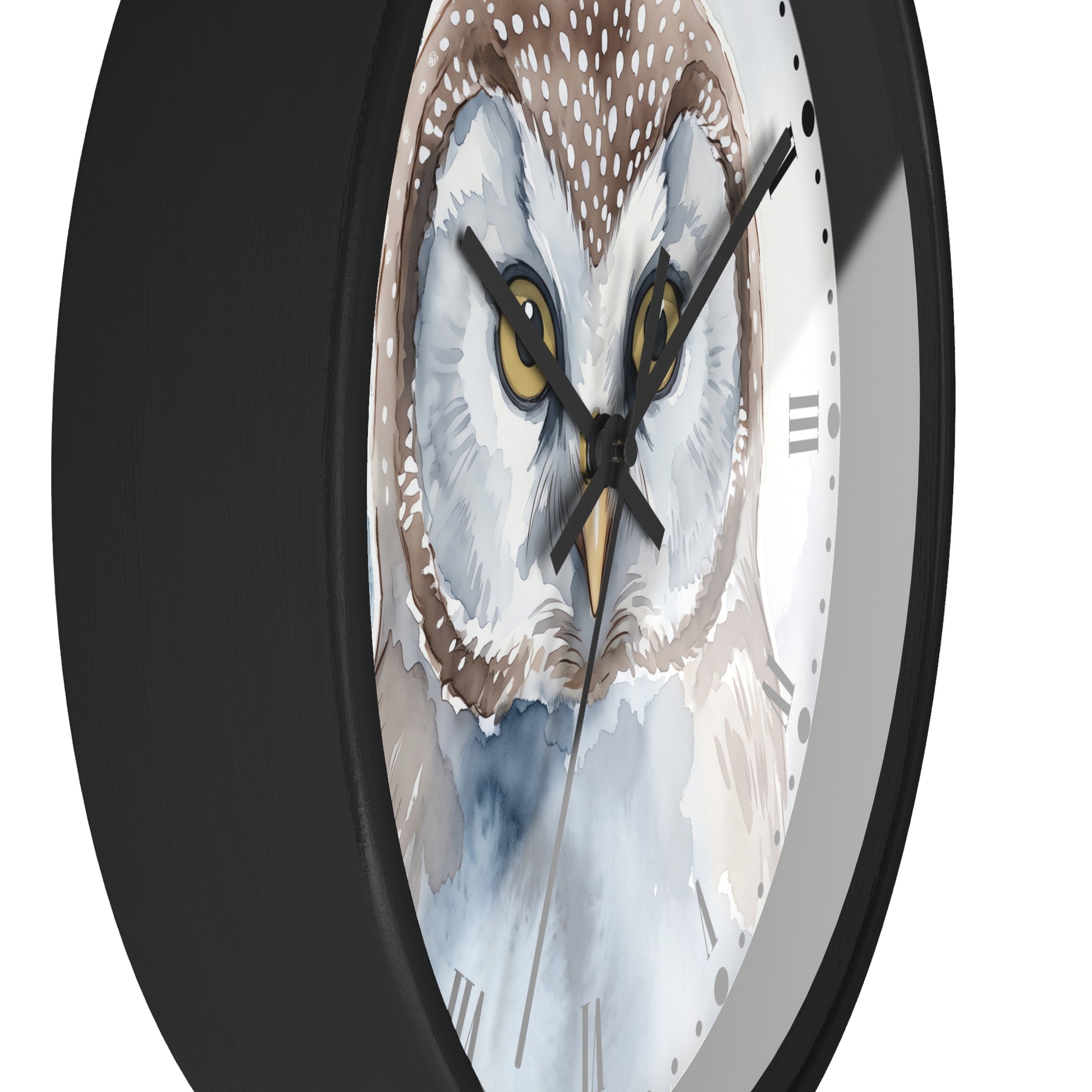 A close-up of a round wall clock with a black frame and a watercolor-style owl face printed on the dial. The owl has large yellow eyes, white and brown feathers, and a light blue lower area.