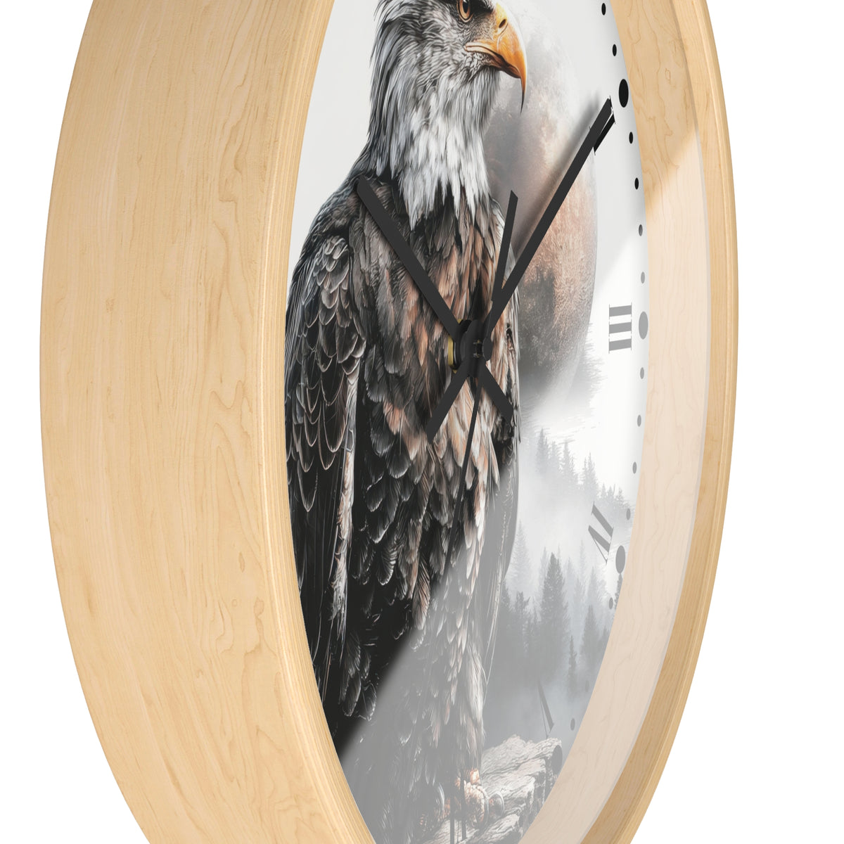Round wall clock with a light natural wood frame and a printed design of a bald eagle over a misty forest scene on the clock face.