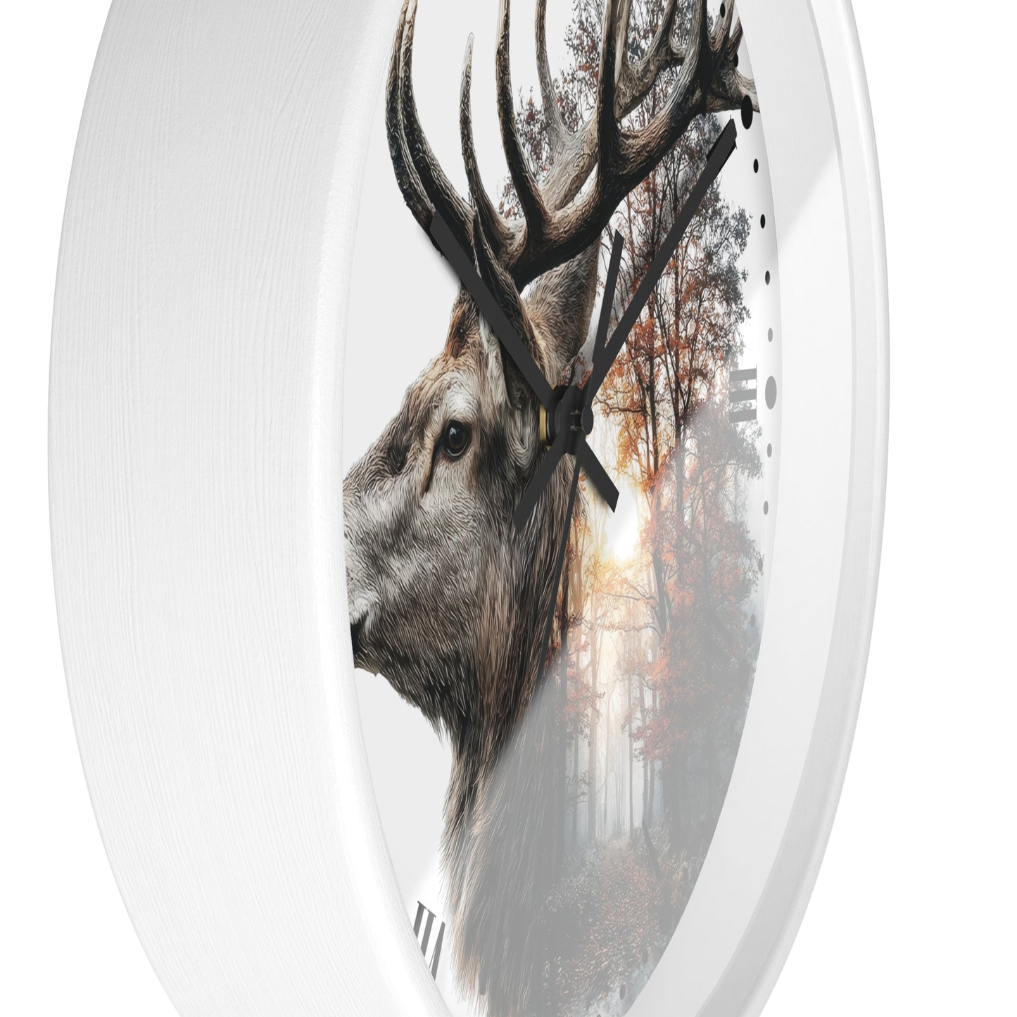 An oval wall clock with a white frame and hands, featuring a printed design of a deer head in profile over a misty forest scene with autumn trees.