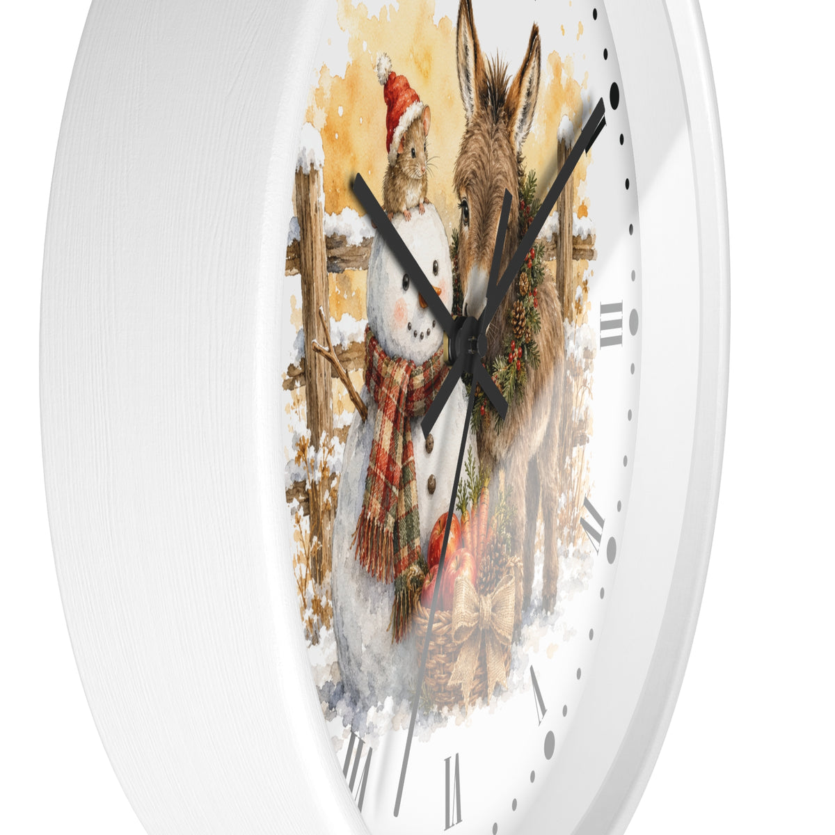 A white round wall clock with a festive winter illustration on the face, showing a snowman in a red Santa hat and scarf next to a donkey with a wreath, against a snowy outdoor scene.